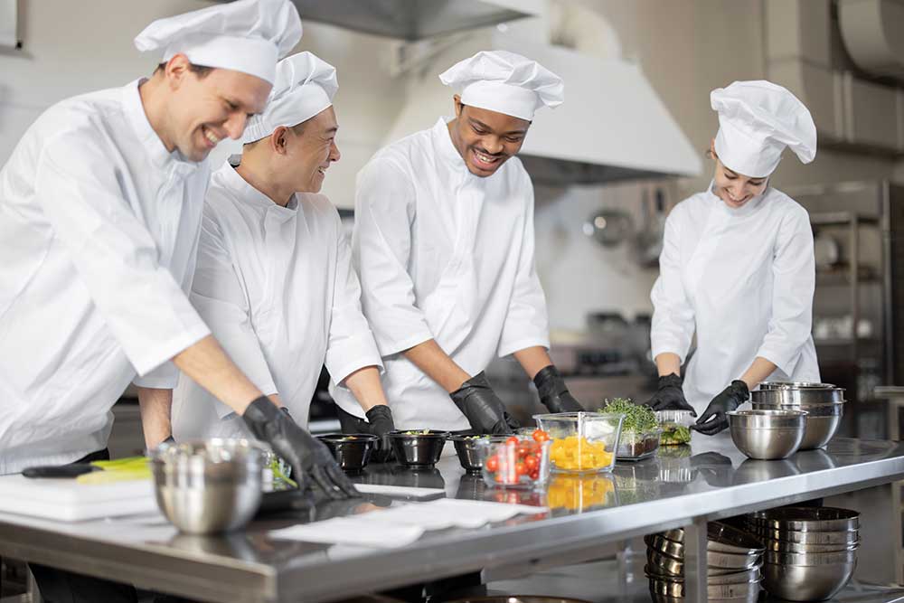 chefs-cooking-in-food-service-kitchen
